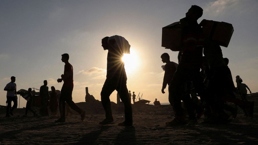 Israeli forces kill at least 25 people near aid trucks in Gaza, witnesses report